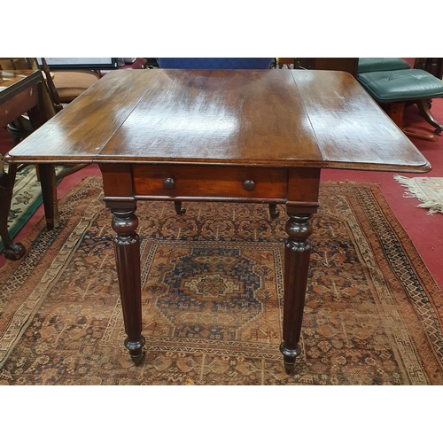 517 - Of good quality. An early 19th Century Mahogany Dropleaf Table with single frieze drawer on turned r... 