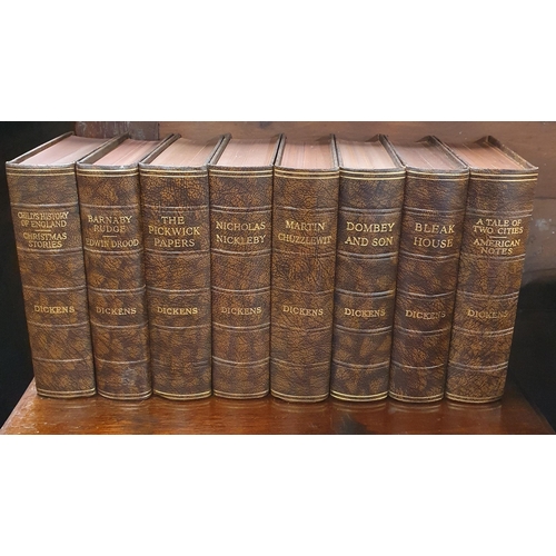 528 - A set of sixteen Odhams Press Dickens Novels,  with half calf leather.