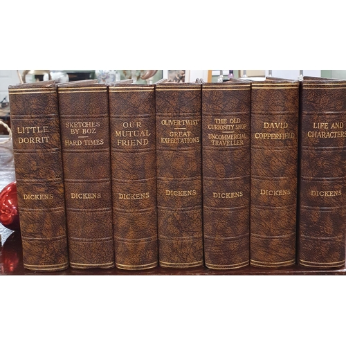 528 - A set of sixteen Odhams Press Dickens Novels,  with half calf leather.