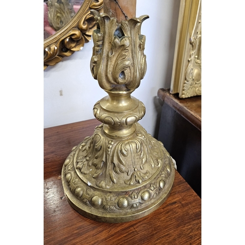 572 - Of Superb quality. A 19th Century Brass candlestick converted to a table Lamp with a highly cast out... 