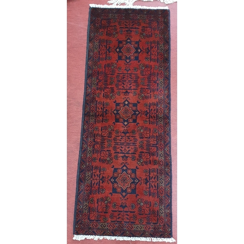 540 - Of Exceptional quality. A Red ground full pile hand woven Tubi double Knotted Runner, 155 x 57 cm ap... 