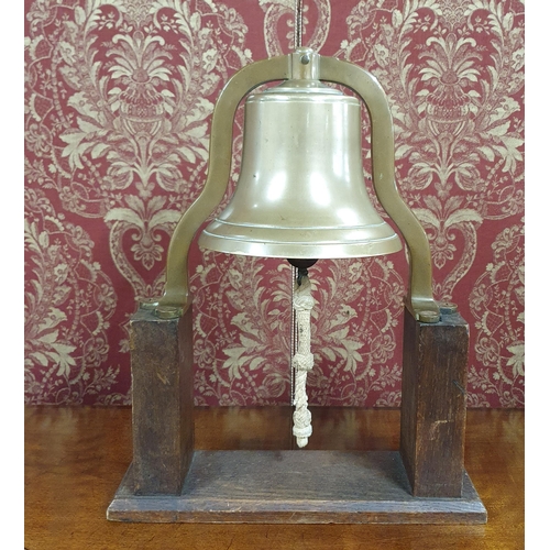 556 - Of excellent quality. A 19th Century Bronze ships Bell mounted on an Oak stand and in original condi... 