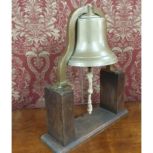 556 - Of excellent quality. A 19th Century Bronze ships Bell mounted on an Oak stand and in original condi... 