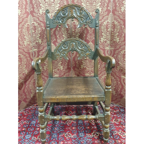 574 - An early 19th possibly 18th Century Oak Bishops Chair with highly carved back on turned supports and... 