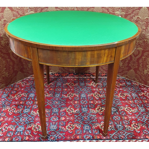 703 - A Regency Mahogany Foldover Card Table with crossbanded inlaid top and frieze and square tapered sup... 