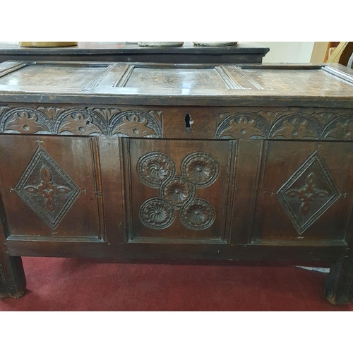 689 - A good early 19th, possibly 18th, Century Oak Blanket Chest with highly carved panelled front.
H 57 ... 