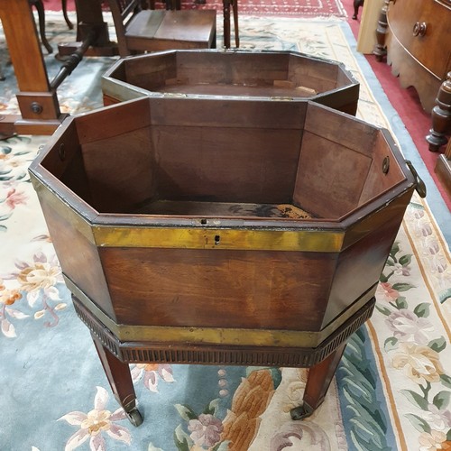 560 - An early 19th Century Mahogany and Brass bound Wine Cooler with heavy brass lifting handles, brass s... 