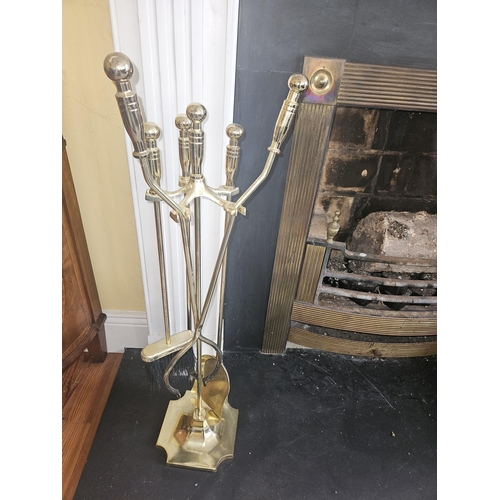 26 - A Brass Companion Set along with two log bins. 
H 180 x W 20 cm approx.