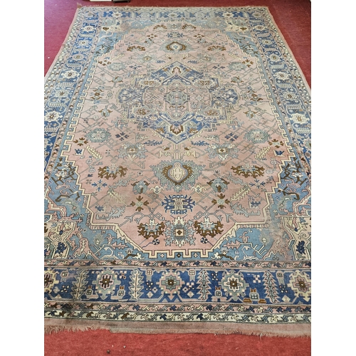 324 - An extremely large Pink ground Carpet with multi borders and unique central medallion design.
370 x ... 