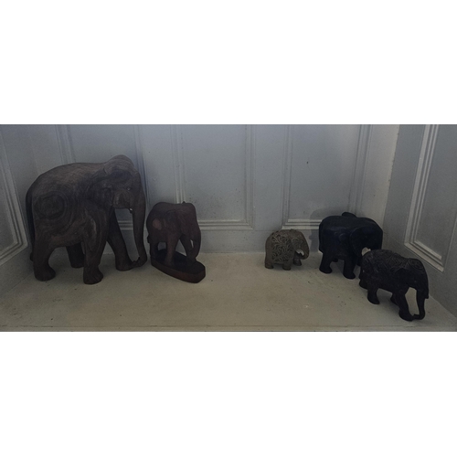 45 - A quantity of Carved Hardwood Elephants. 
Largest H 30 x 37 cm approx.