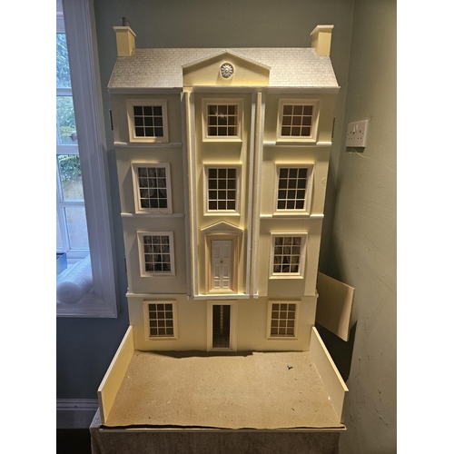 62 - A good Scratch Built Dolls House on table base. 
H 100 x D 64 x W 64 cm approx.