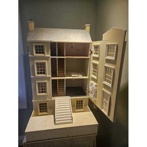 62 - A good Scratch Built Dolls House on table base. 
H 100 x D 64 x W 64 cm approx.