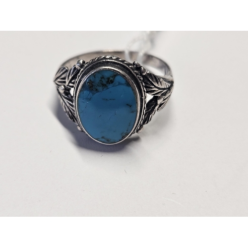 415 - A Silver and Turquoise set Ring, size T.