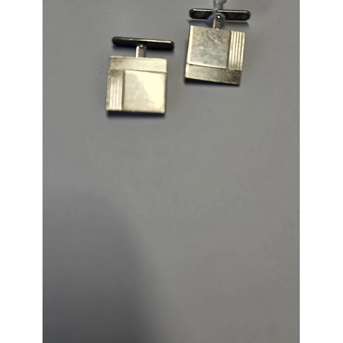 418 - A pair of Silver Cufflinks.