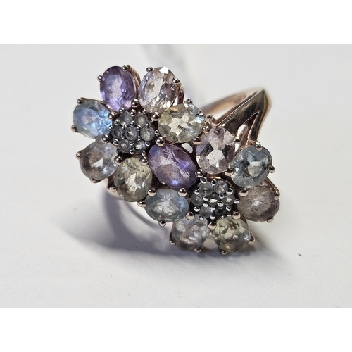 431 - A large Silver cluster Ring, size O.