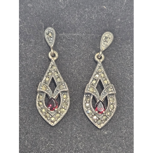 434 - A pair of Silver, Marcasite and Garnet drop Earrings.