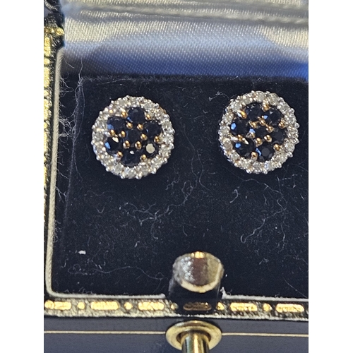 441 - A 9ct Gold, Sapphire and Diamond cluster Earrings.