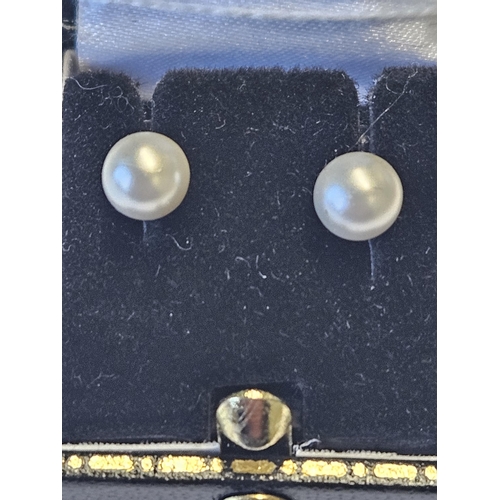 443 - A pair of 9ct Gold and Pearl ball Earrings.