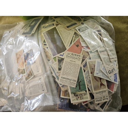 470 - A large quantity of Cigarette Cards, Postcards and Coins.