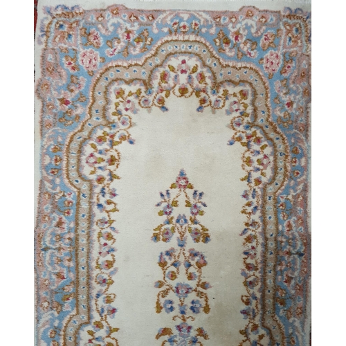 500 - A Vintage hand woven Persian Kerman Cream ground Runner with floral design. 240 x 78 approx.