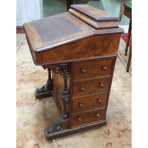 1093 - A 19th Century Walnut and Burr Walnut Davenport with lift up lid on carved front supports. 53 x D 49... 