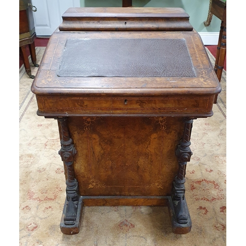 1093 - A 19th Century Walnut and Burr Walnut Davenport with lift up lid on carved front supports. 53 x D 49... 