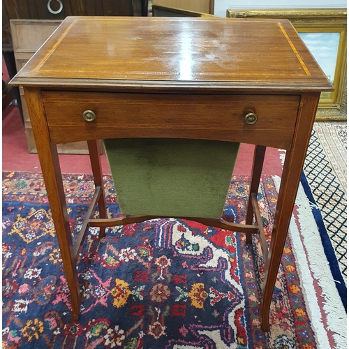 1101 - An Edwardian Mahogany and inlaid side Table with single freeze drawer on square tapered supports.