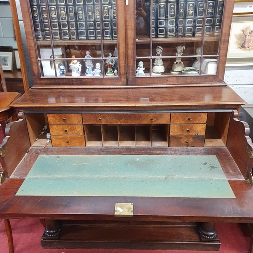 493 - A Regency Mahogany Secretaire Bookcase possibly Irish, with glazed upper section and pillared and dr... 