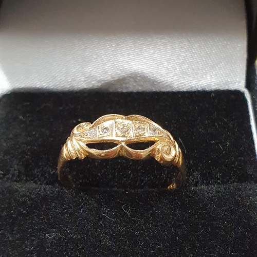 447 - A lovely 18ct Gold and Diamond Ring with pierced detail, size M