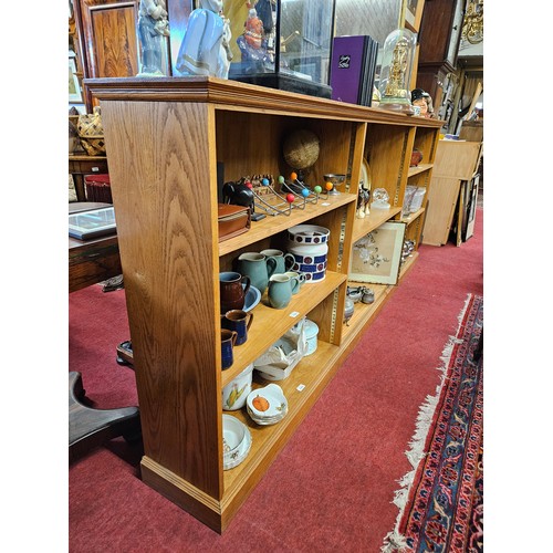 1121 - An extremely large Oak open Bookshelves with adjustable shelves. W 275 x 32 x H 112 cm approx.