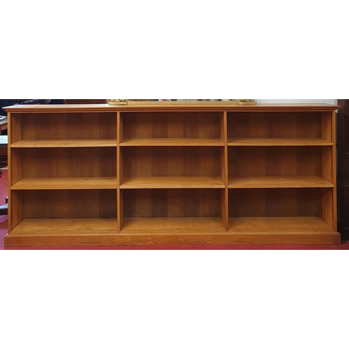 1121 - An extremely large Oak open Bookshelves with adjustable shelves. W 275 x 32 x H 112 cm approx.