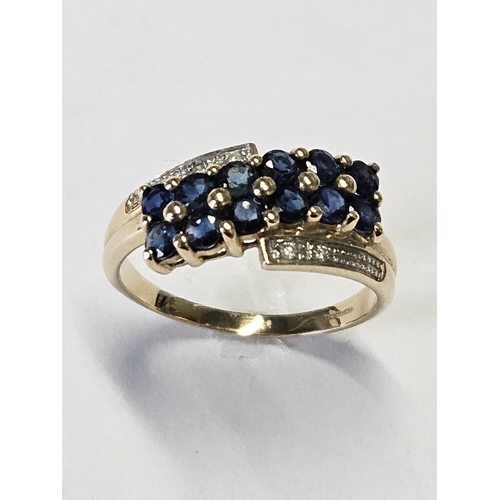 318 - A 9ct Gold, Diamond and Sapphire set cluster Ring, size Q.