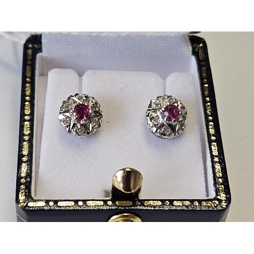 320 - A pair of 18ct Gold, Diamond and Ruby cluster Earrings.