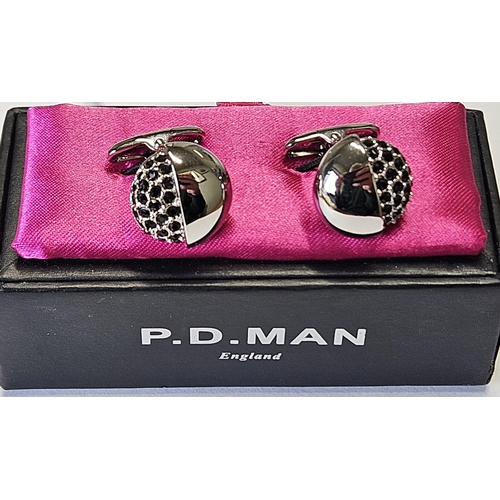 321 - A pair of designer Cufflinks.