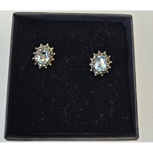 323 - A pair of Silver, Topaz and Marcasite Earrings.