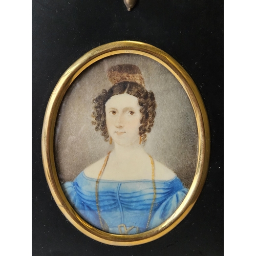 A 19th Century Watercolour of a young Woman in Blue dress.