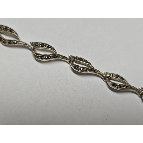 403 - A Silver and Marcasite Bracelet.