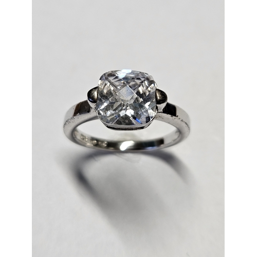 415 - A Silver and Cubic Zirconia Ring, size K.