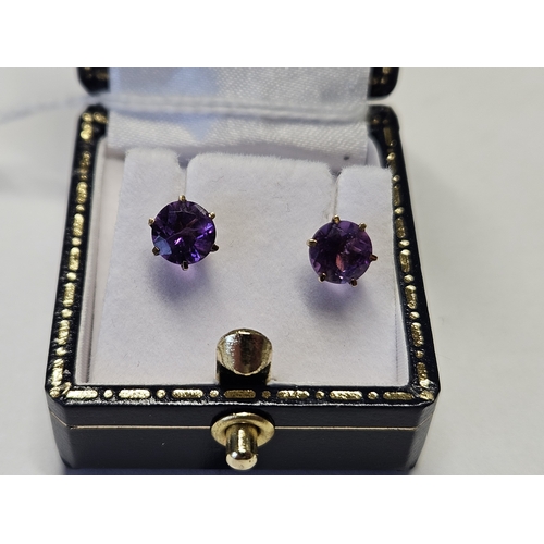 419 - A pair of 9ct Gold and Amethyst Earrings.