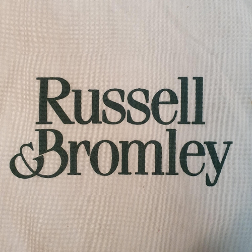 129 - A Russell & Bromley Hand Bag. Brown  Suede. Pre-owned, excellent condition. Retails at €250.