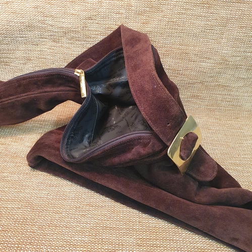 129 - A Russell & Bromley Hand Bag. Brown  Suede. Pre-owned, excellent condition. Retails at €250.