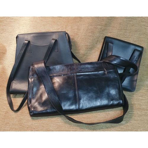 131 - A group of three Ladies Leather Hand Bags to include Designer bag by Flavell & Flavell, Nicole Farhi... 