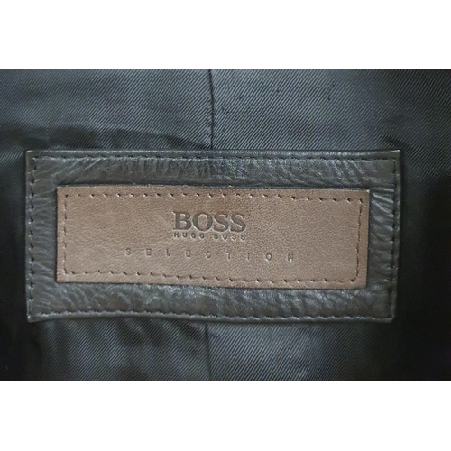 153 - A Hugo Boss Men's Jacket. Black Leather, size 50.
Pre-owned, excellent condition, Retails at €500 .