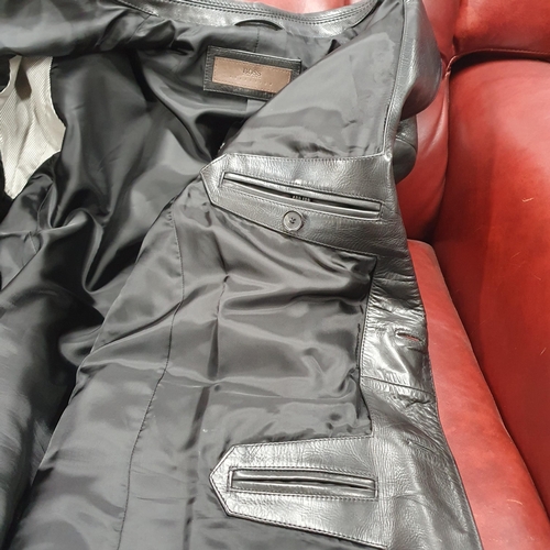 153 - A Hugo Boss Men's Jacket. Black Leather, size 50.
Pre-owned, excellent condition, Retails at €500 .