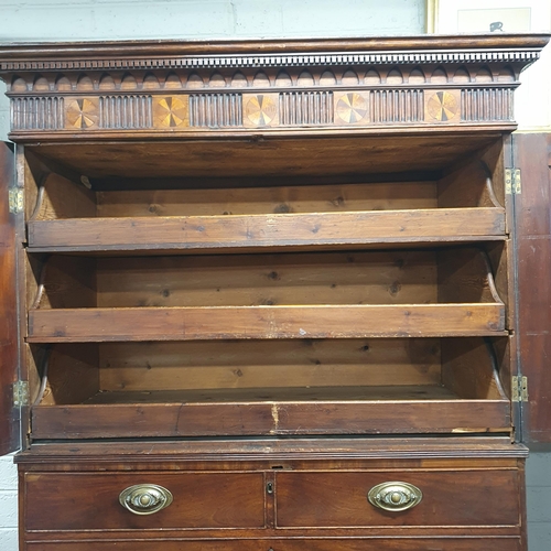 9 - An early 19th Century Mahogany Gentleman's Cupboard with shirt drawer interior top and secretaire ce... 