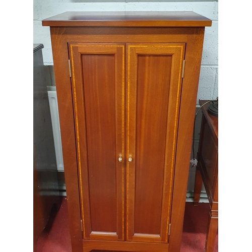 178 - A Reproduction Mahogany and Inlaid two door Cabinet of narrow proportions.
W 58 x D 38 x H 117 cm ap... 