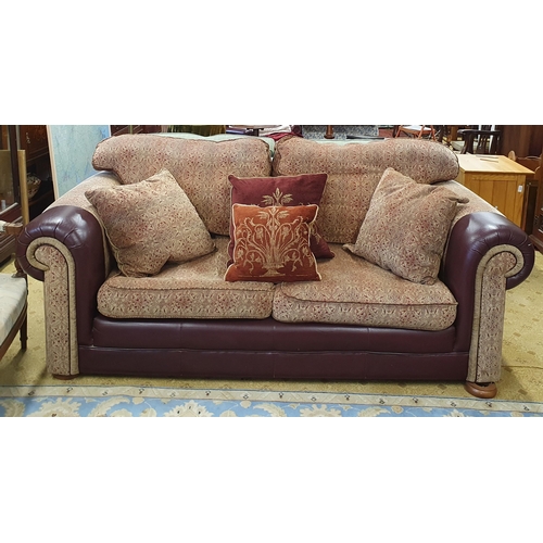 362 - A large Couch upholstered with burgundy fabric and trim.
SH 45 x W 210 x D 110 cm approx.