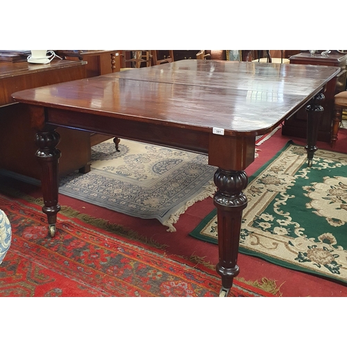 381 - A really good 19th Century Mahogany single leaf Dining Table on turned fluted supports and brass cas... 