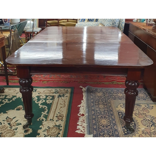 381 - A really good 19th Century Mahogany single leaf Dining Table on turned fluted supports and brass cas... 