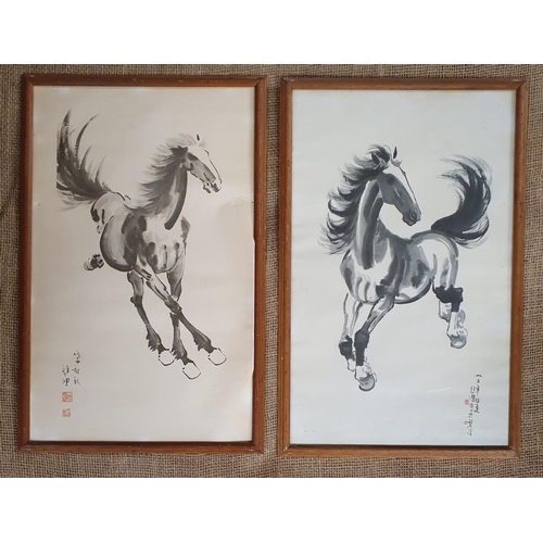 383 - A good pair of early 20th Century Oriental prints of Horses. H 47 x W 29 cm approx.